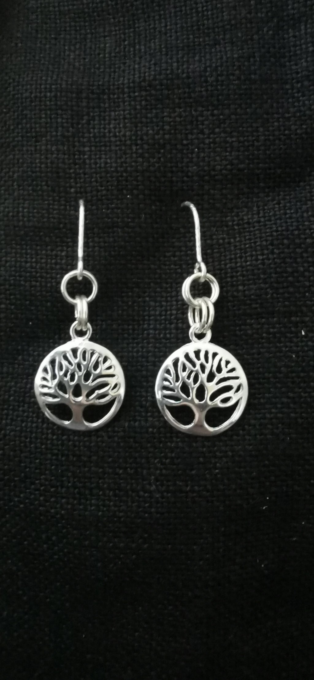A pair of silver tree of life dangle earrings 