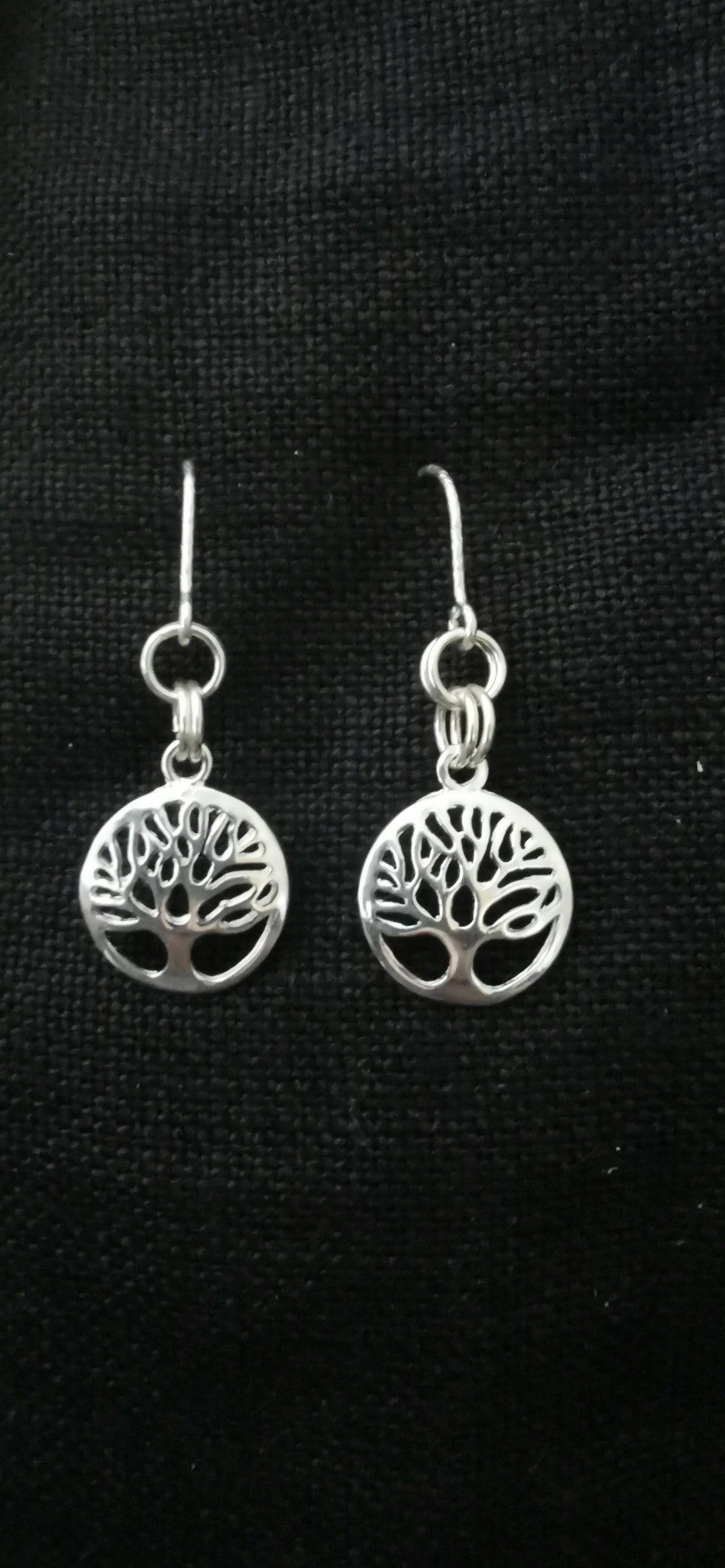 A pair of silver tree of life dangle earrings 